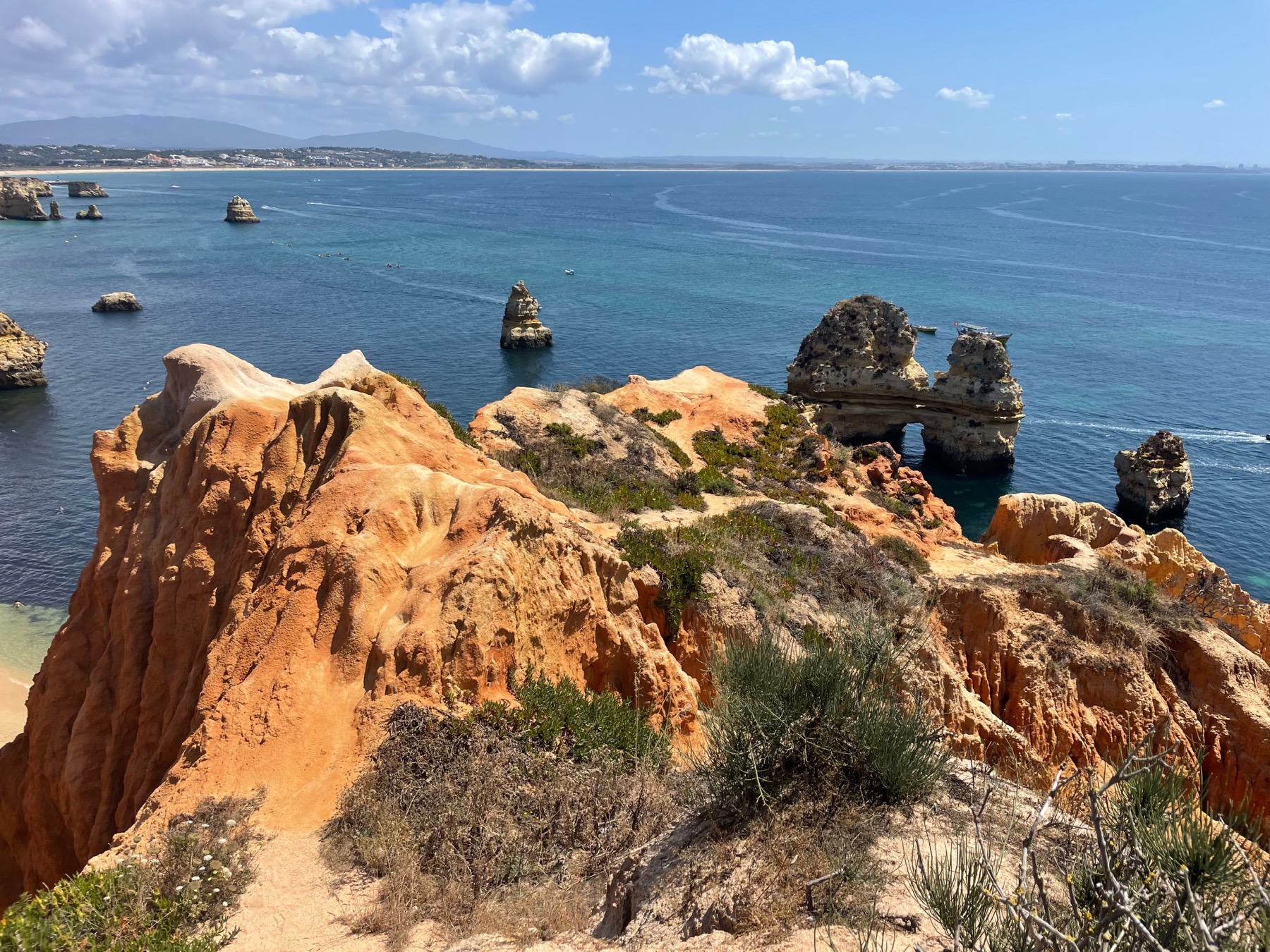 Golden cliffs and clear Atlantic water at Praia do Camilo near Lagos