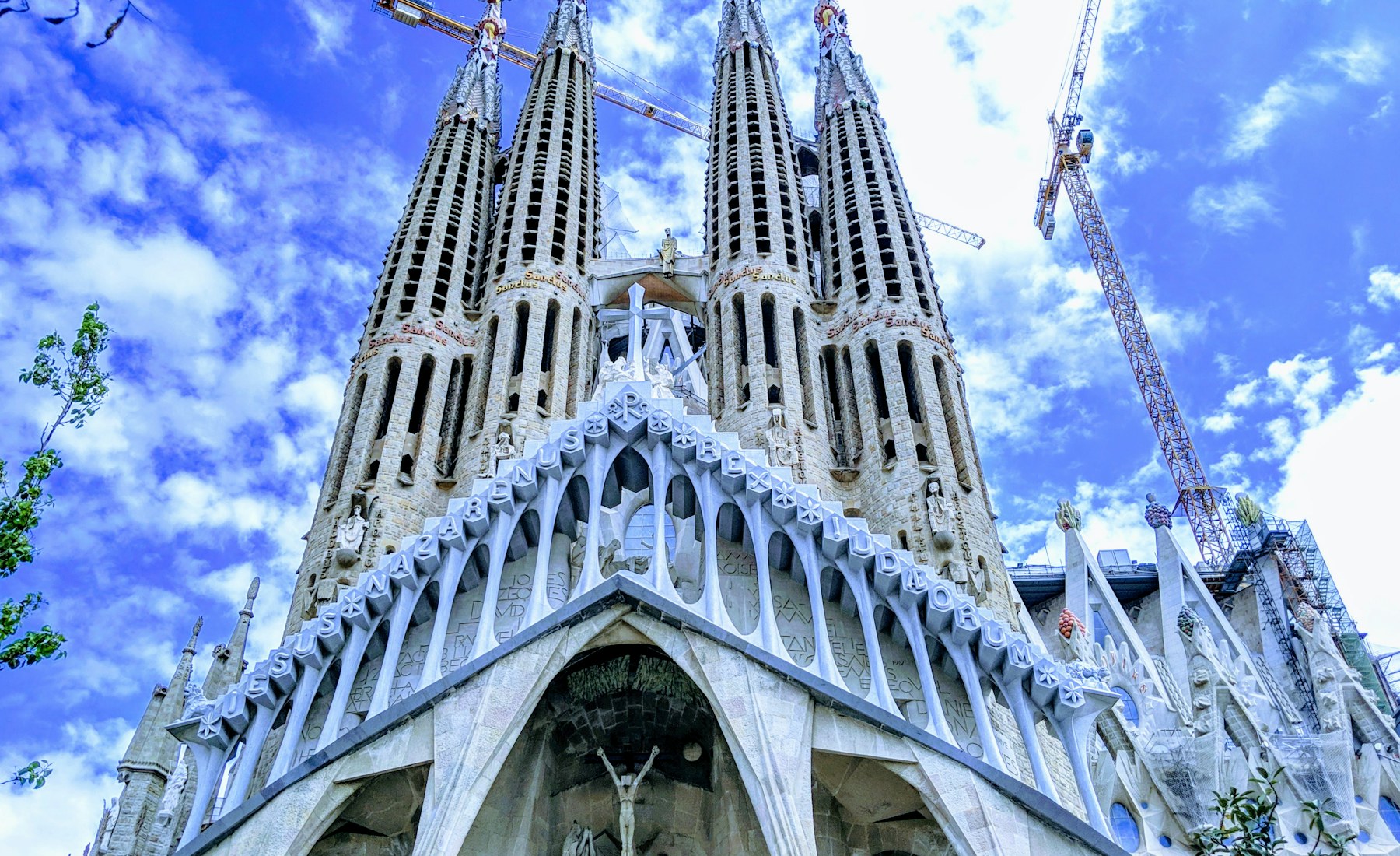 La Sagrada Familia rising beneath a blue Barcelona sky