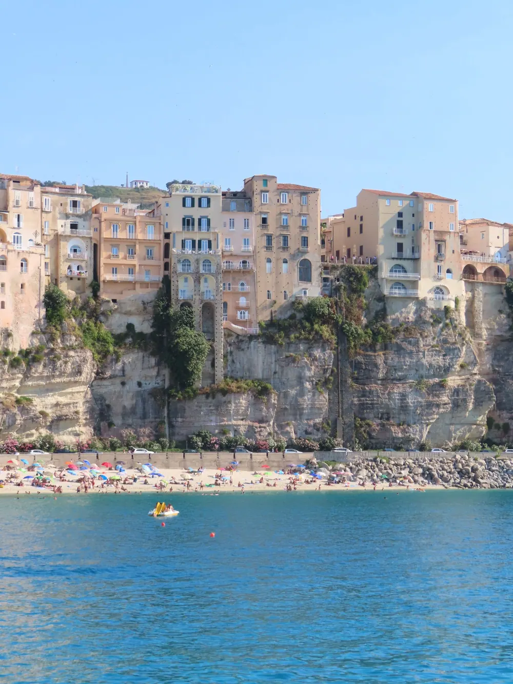 Tropea's historic buildings rising above cliffs and the turquoise Tyrrhenian Sea