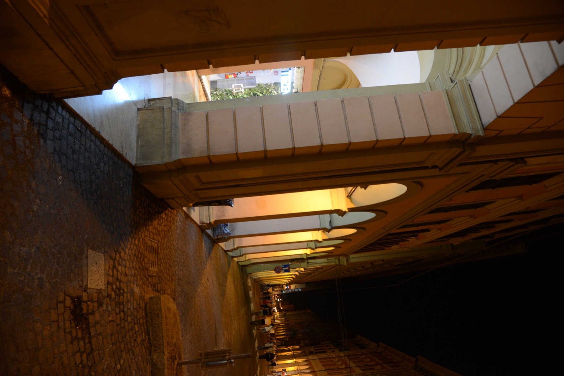 Bologna's illuminated porticoes at night