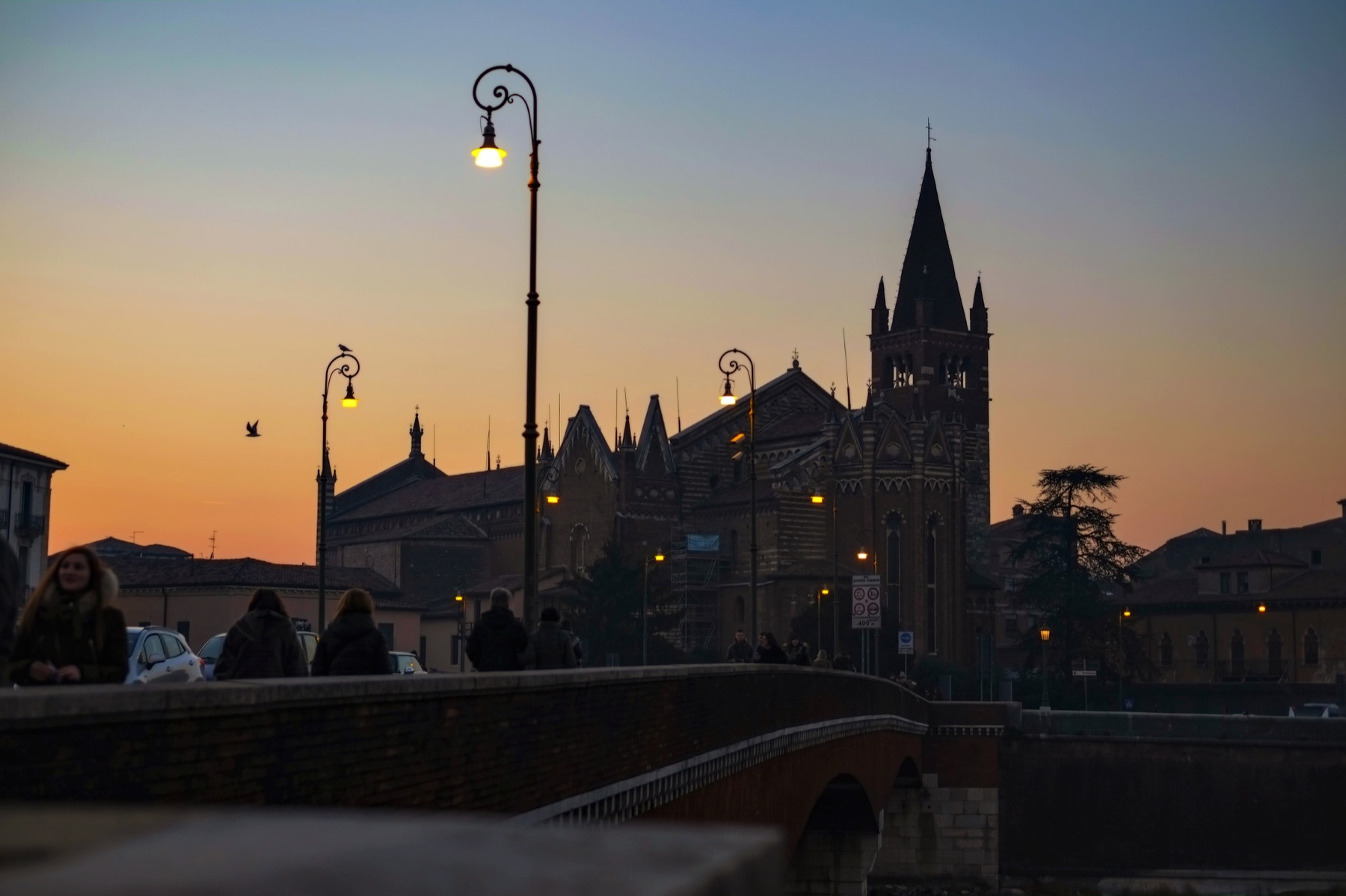Verona architecture and street lamps in warm evening light