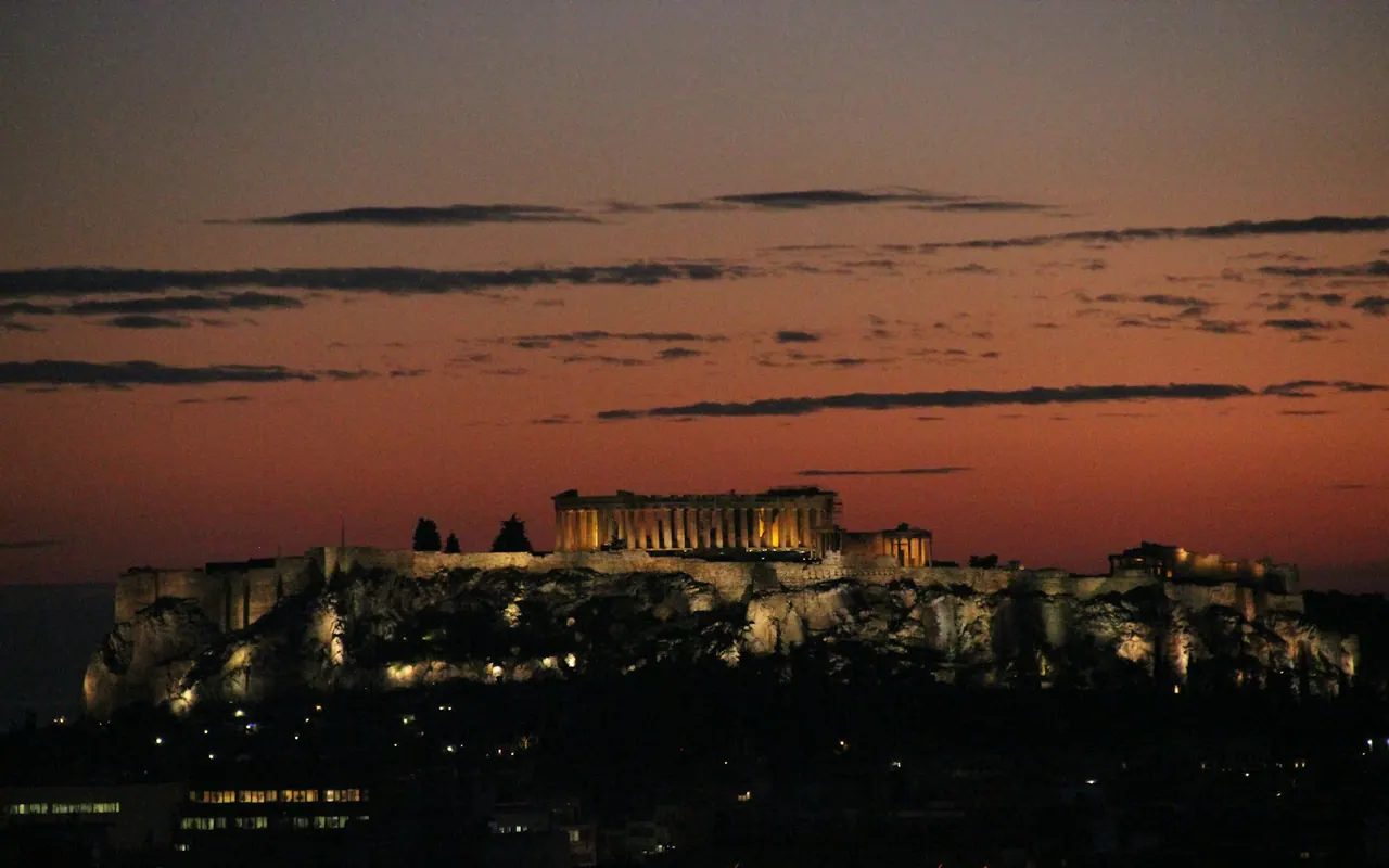 The illuminated Acropolis above Athens at sunset