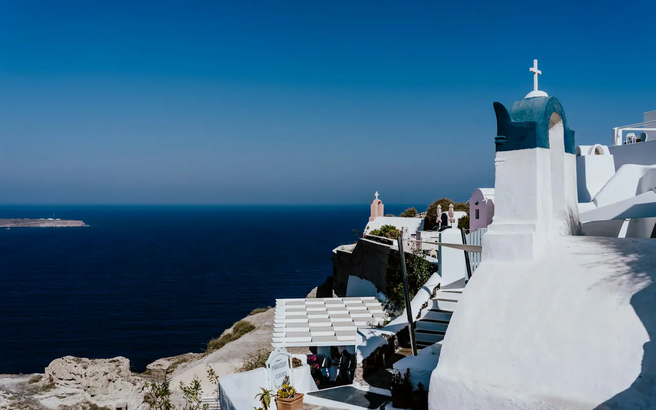 Whitewashed Santorini architecture above the Aegean Sea