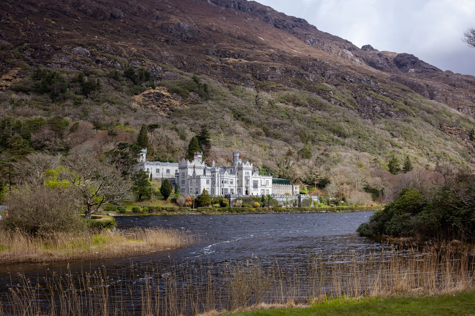 Kylemore Abbey beside the mountains and water of Connemara