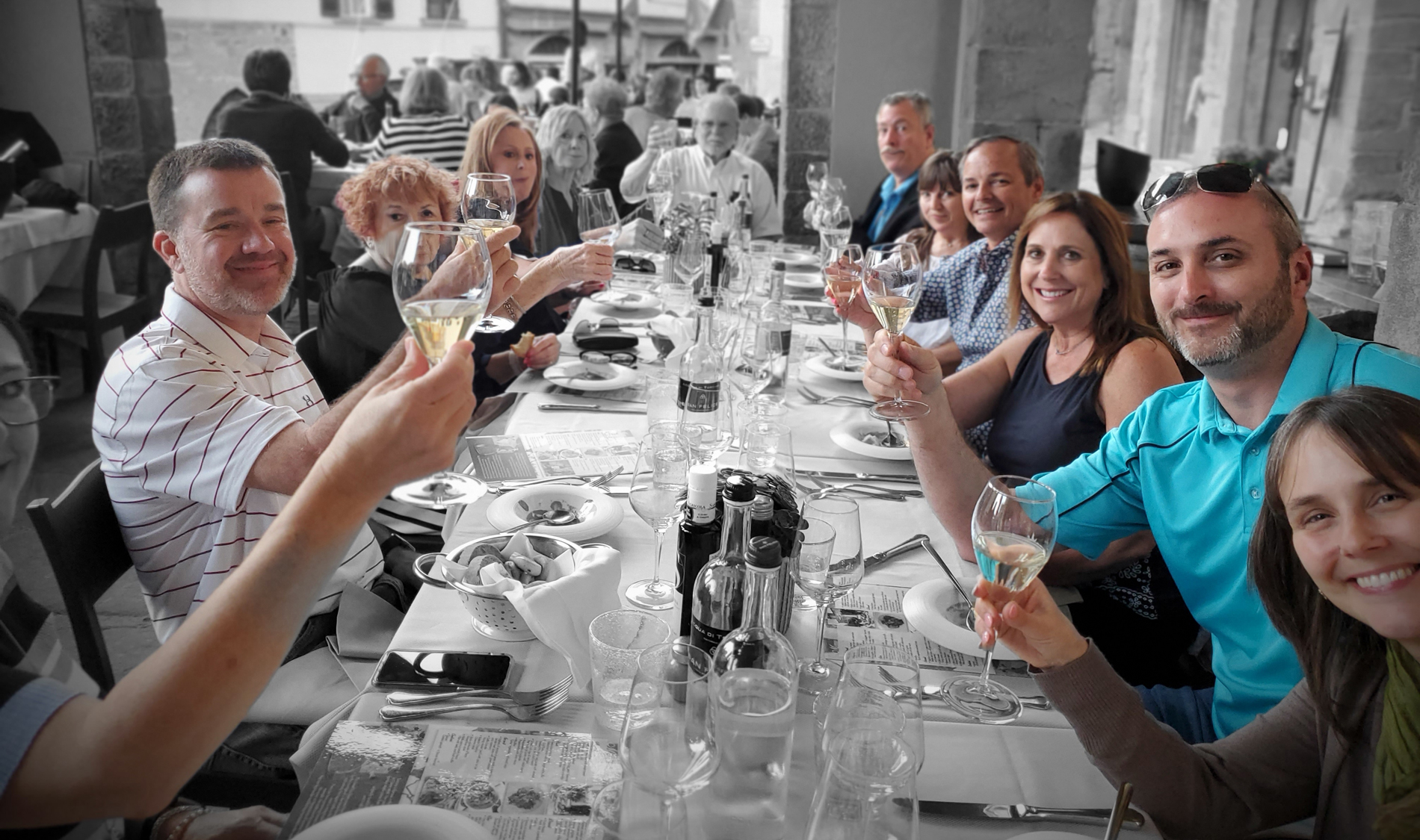 Now Journey guests raising a glass together around a table